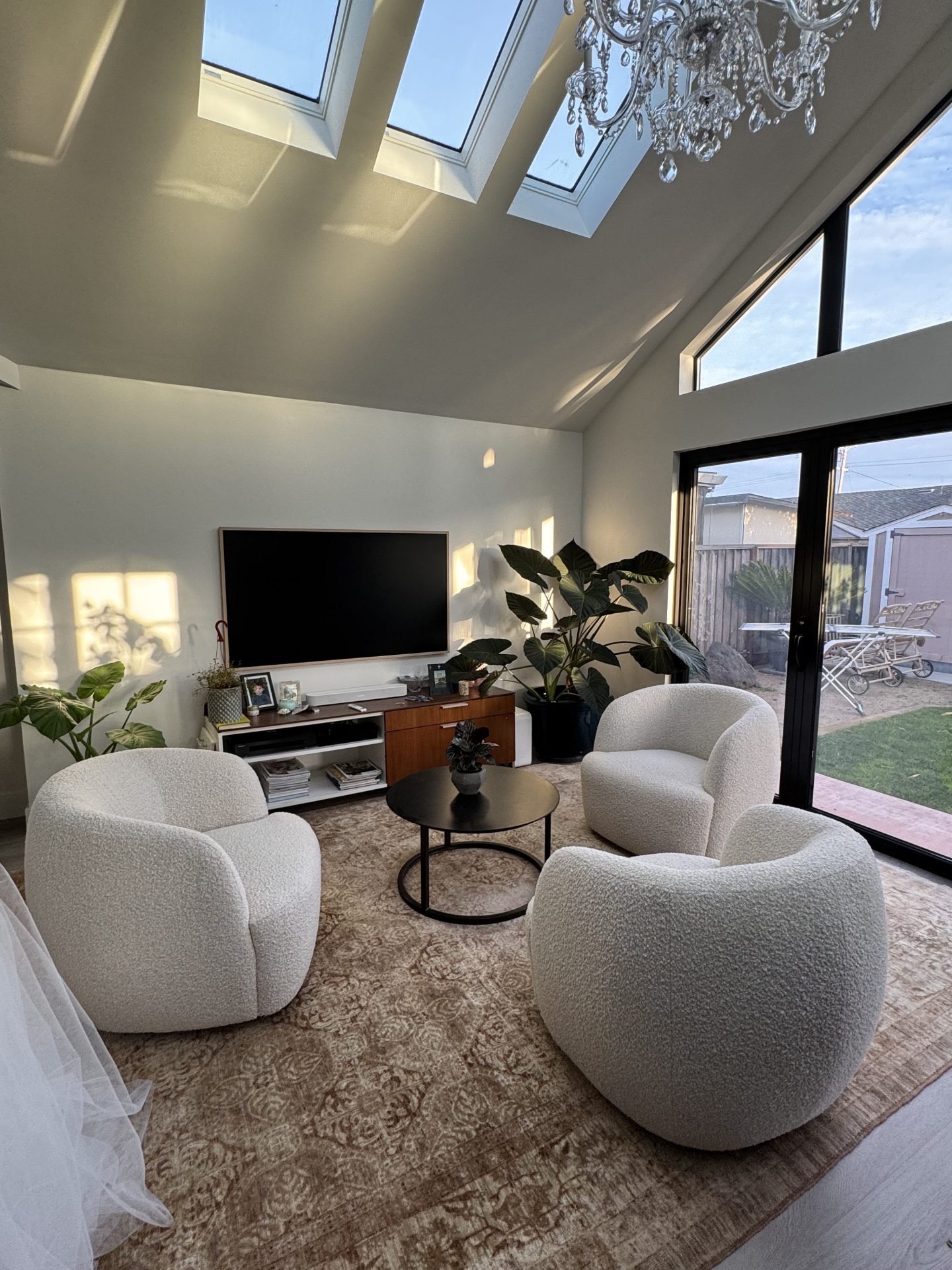 Contemporary seating area beneath linear skylights in a Fremont modern renovation